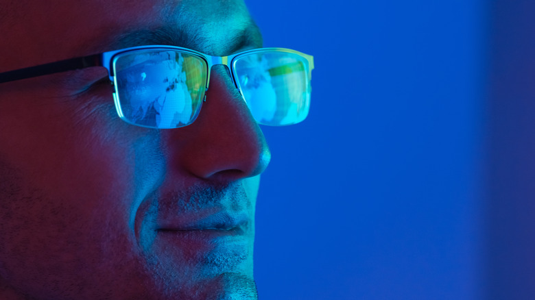 Man wearing blue light glasses