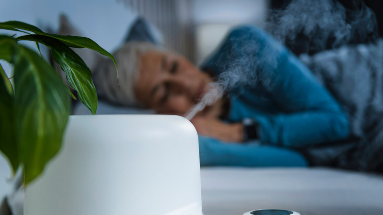 Woman sleeping with humidifier