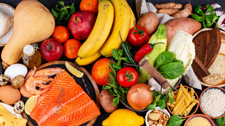 assorted fruits, vegetables, oil, whole grains, and salmon