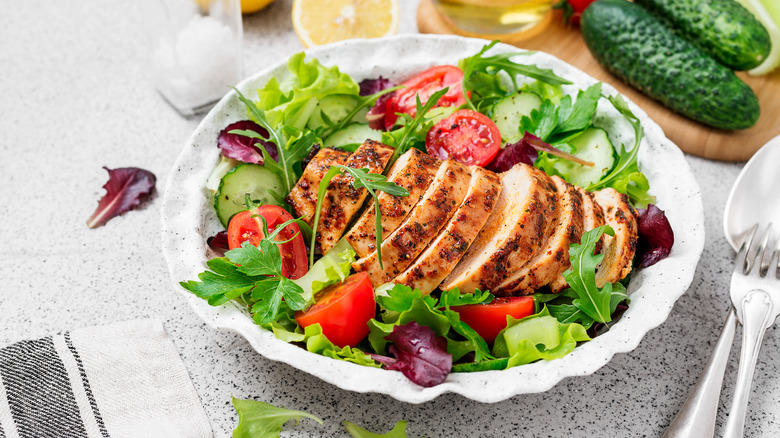 healthy salad with vegetables and grilled chicken