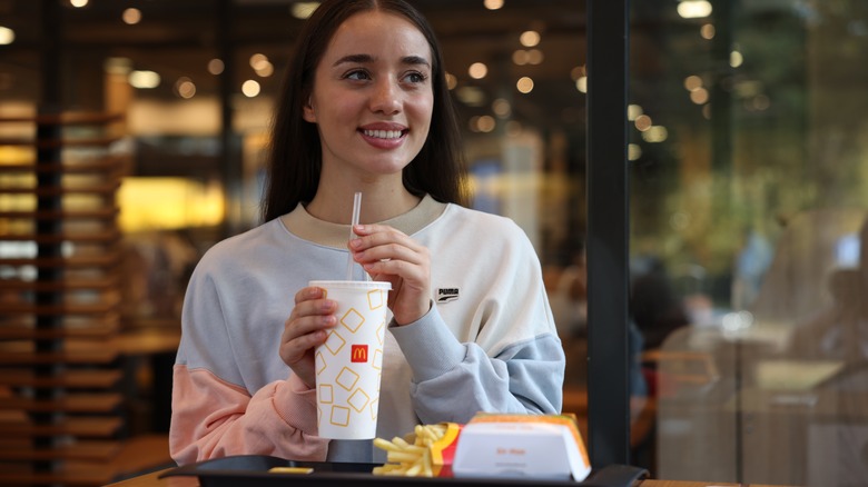 woman eating a mcdonald's meal