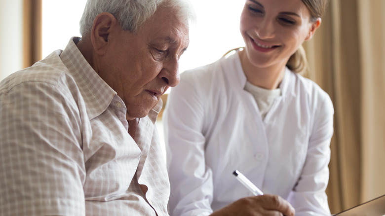 older man with caregiver