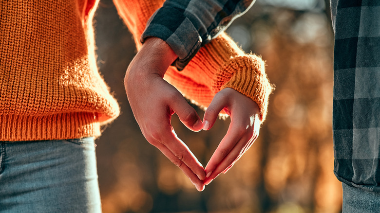 Two hands making heart shape