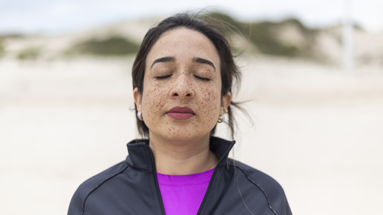 woman breathing in mindfully