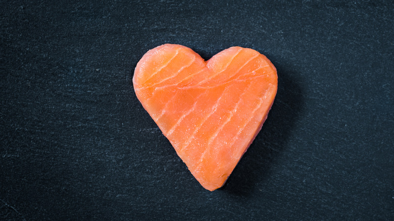 a piece of salmon shaped as a heart 