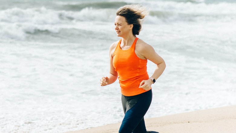 Woman running on beach