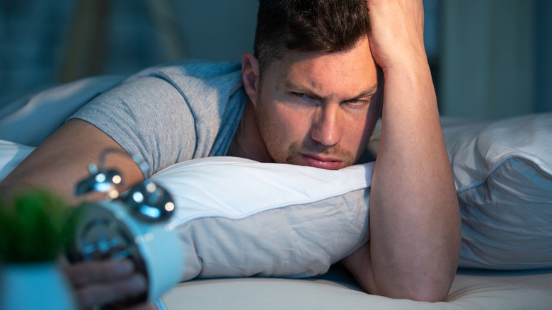 man suffering from insomnia