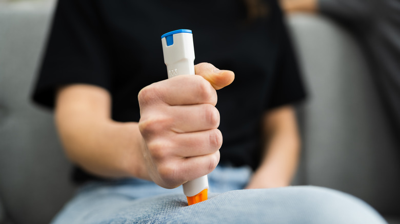 Woman holding epinephrine 