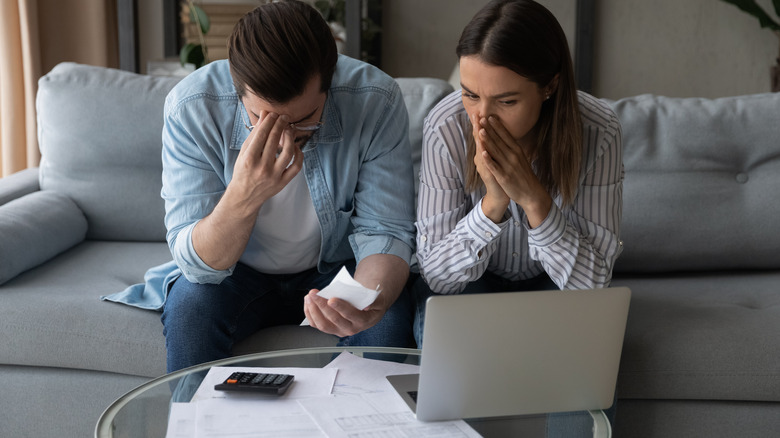 Young couple stressed over bills