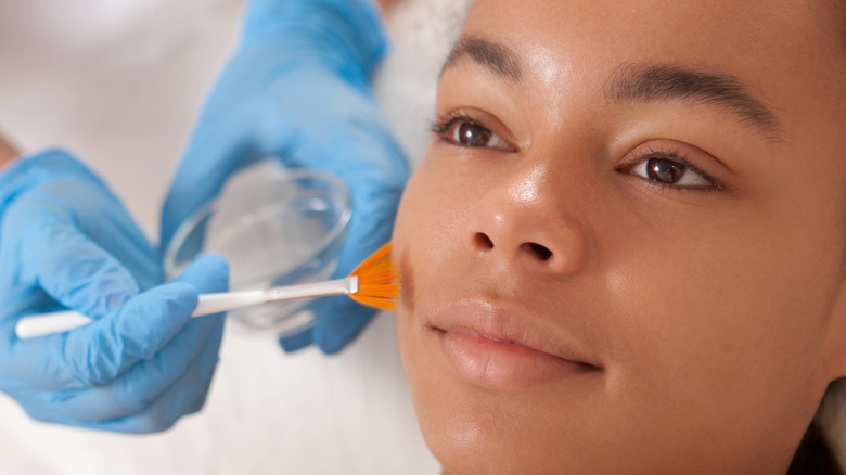 Woman receiving facial care