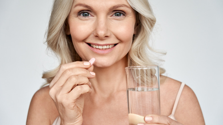 woman taking medications