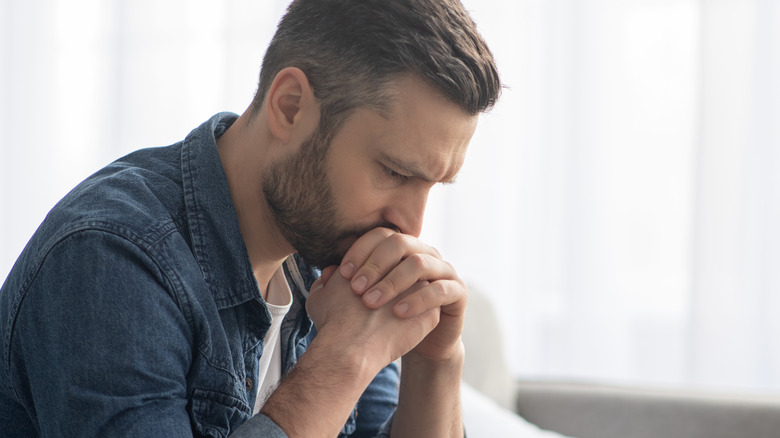 Man resting chin on hands