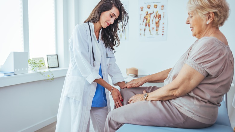 doctor examining patient