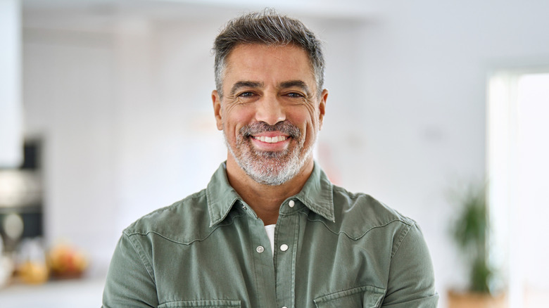 A healthy middle-aged man smiling