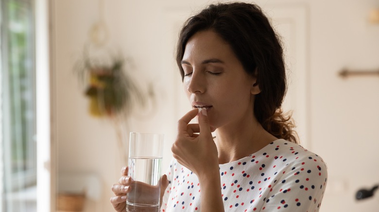 woman taking medication