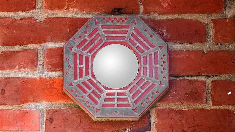 Bagua map on red brick wall