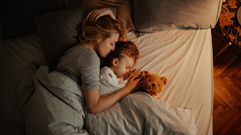 woman and daughter sleeping peacefully