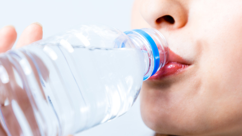 young woman drinking water