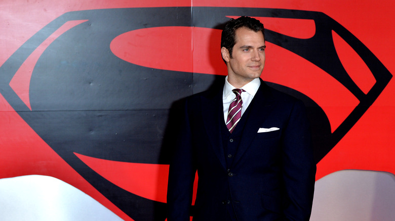 henry cavill with superman logo