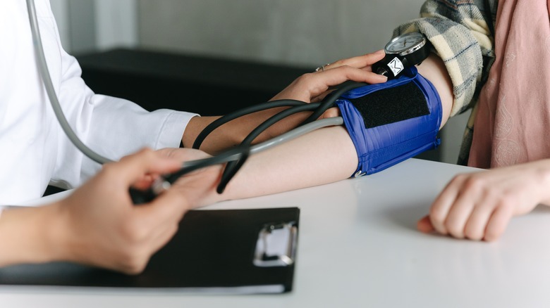 Person having blood pressure taken