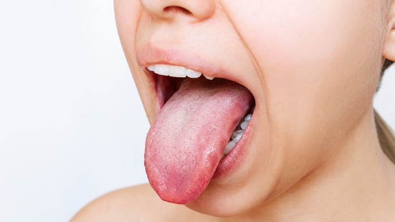 Woman sticking tongue out