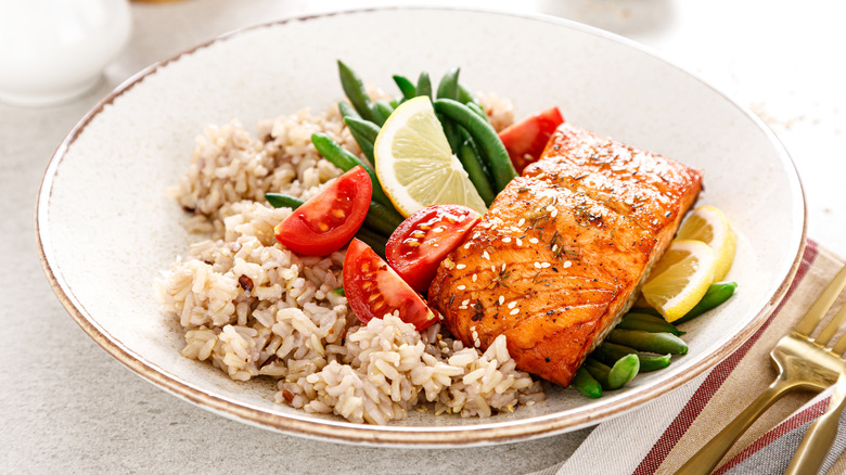 plate of fish, rice, and vegetables