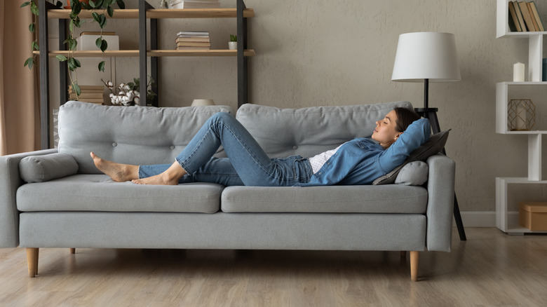 Woman resting on couch