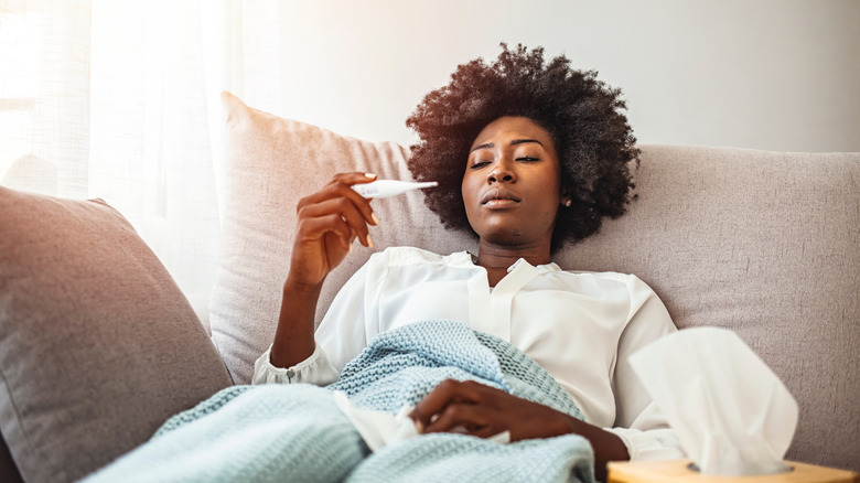 woman taking temperature