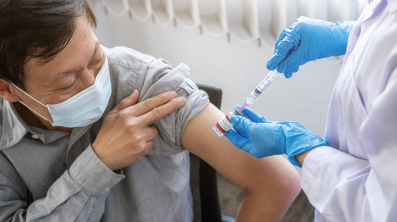 A man gets a vaccine