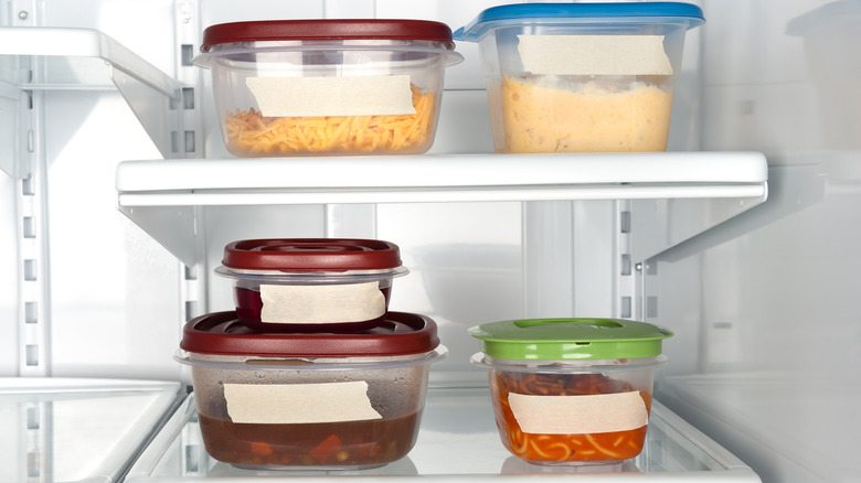 leftovers in containers in a fridge