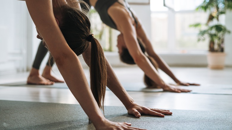 women practicing yoga