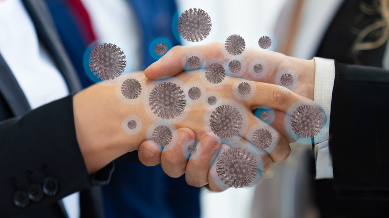 Germs being transferred between hands 