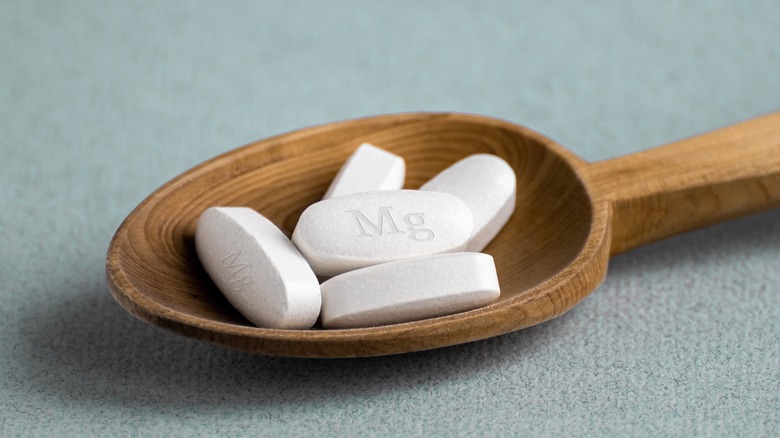 magesium tablets in wooden spoon