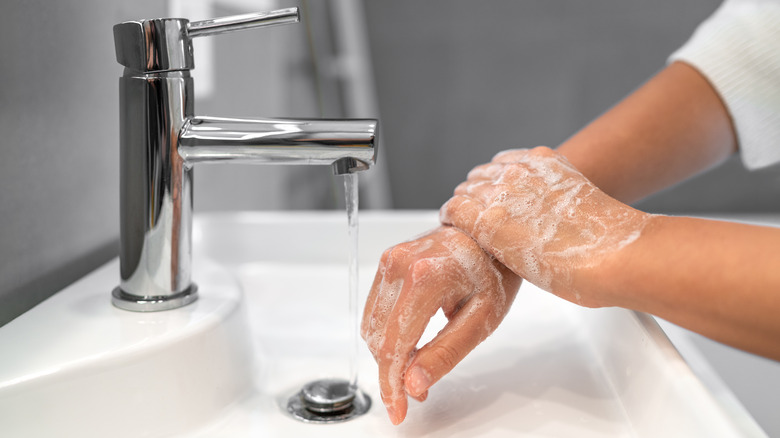 washing hands under running water