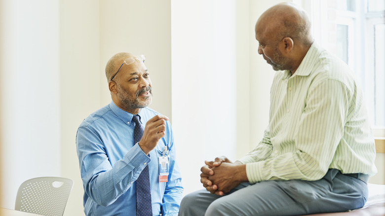 Doctor speaking with patient