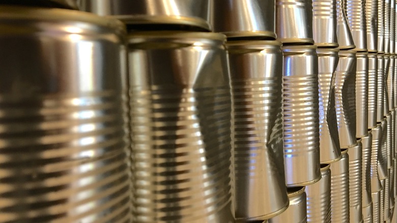 Rows of dented cans