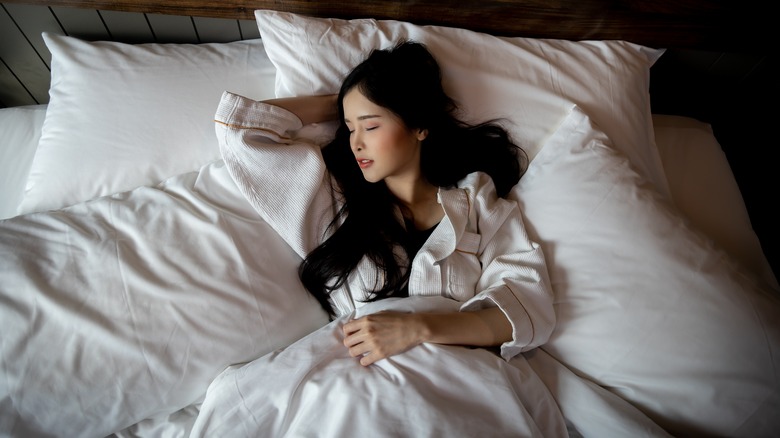 Woman sleeping in bed