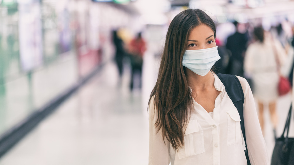 Woman wearing a mask in public