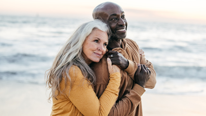 Romantic couple walking on beach