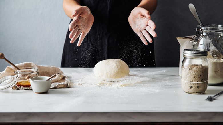 A woman's hands kneading sourdough