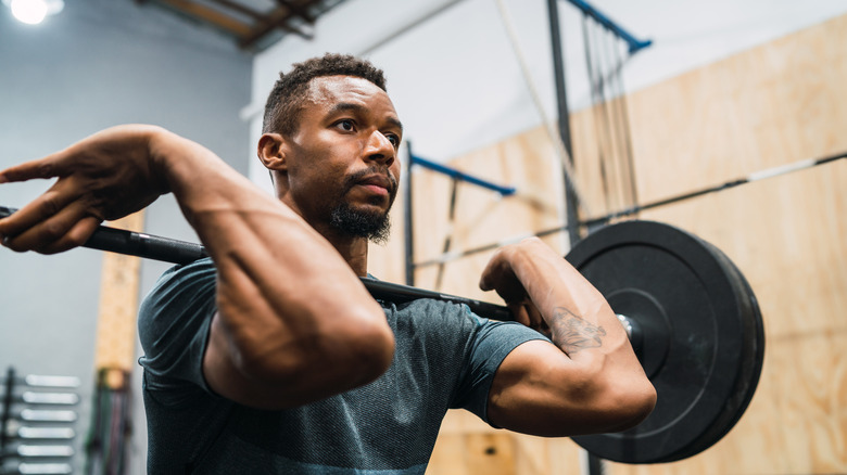 a man lifting with a barbell