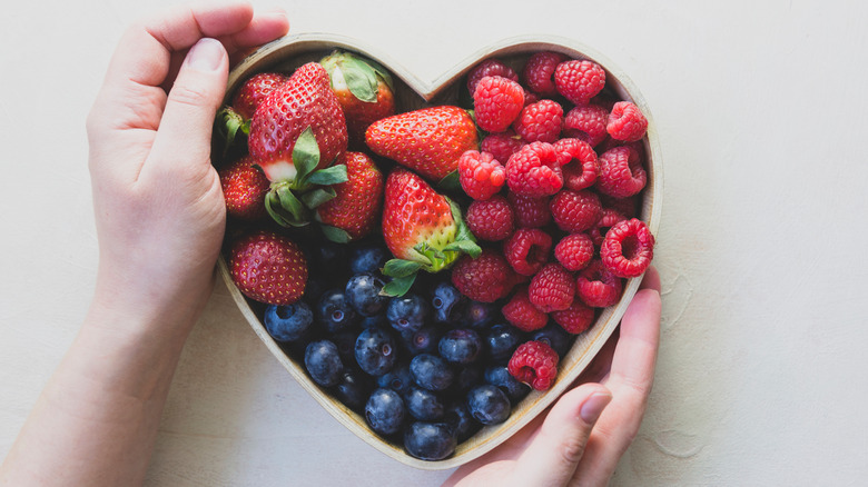 heart-shaped bowl of mixed berries