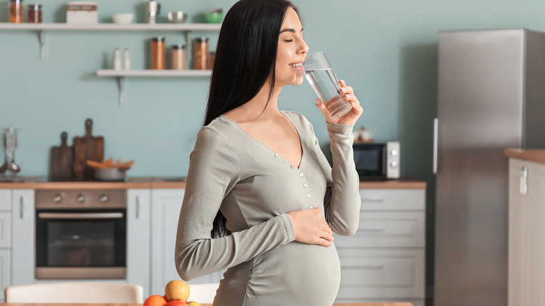 Pregnant woman drinking water