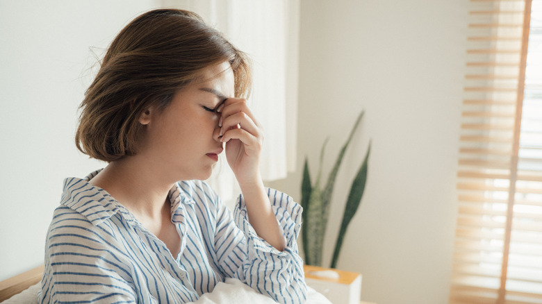 Woman sitting up in bed