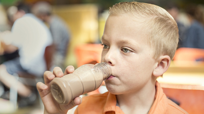 Child drinking chocolate milk