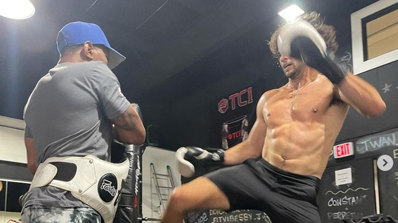 Actor Noah Centineo kickboxing at the gym 