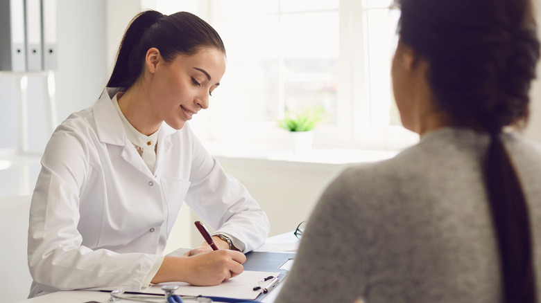 woman speaking with her doctor