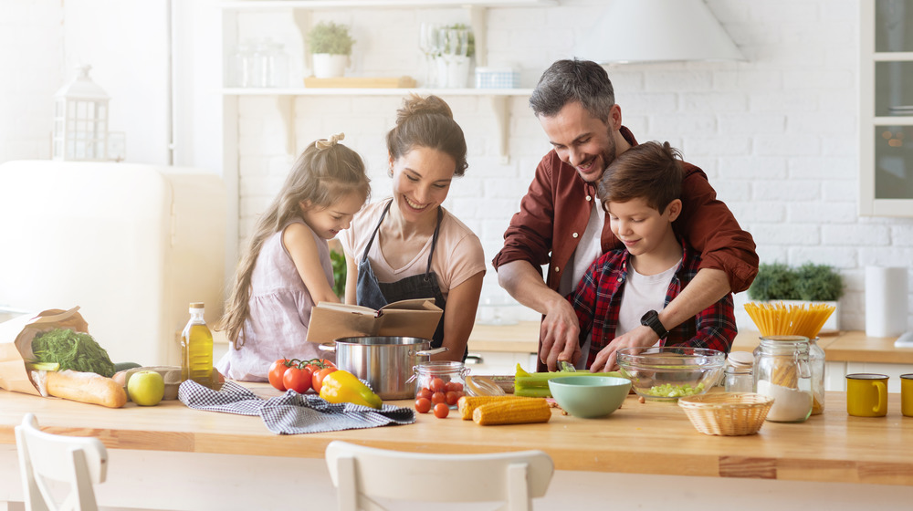 family cooking a meal together