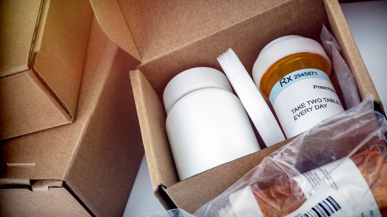 Several boxes with prescription medications inside