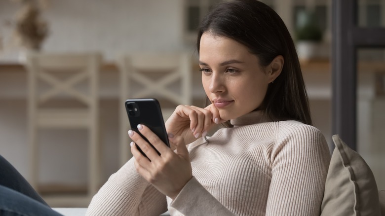 Woman focused on her phone